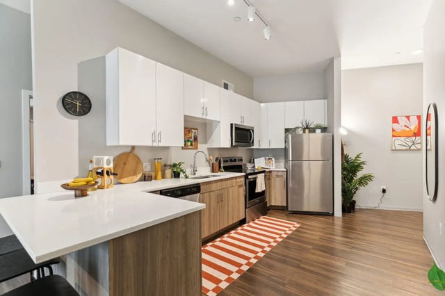 Modern kitchen with stainless steel appliances and island kitchen at Paloma at University City in Philadelphia Student Accommodation