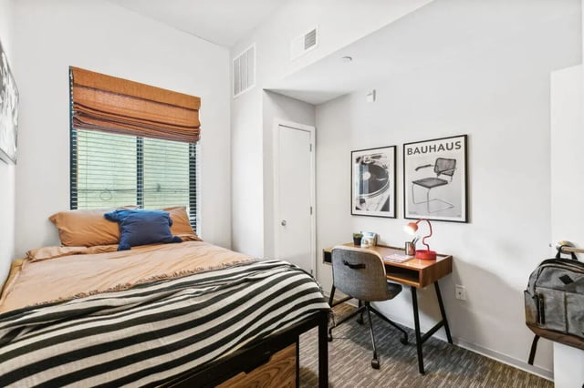 Bed desk chair artwork and backpack bedroom at Paloma at University City in Philadelphia Student Accommodation