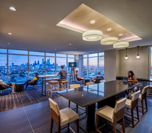 Modern common area with large windows living room at Vantage in Philadelphia Student Accommodation