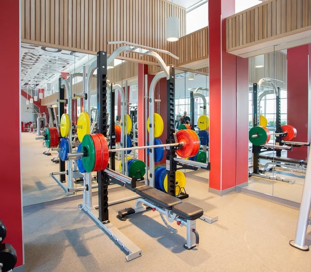 Weight racks with colorful plates gym area at Vantage in Philadelphia Student Accommodation