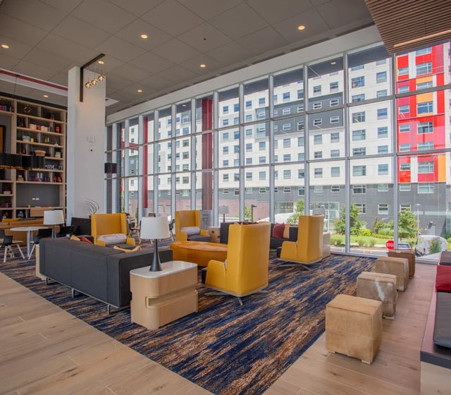 Sofa yellow chairs modern lounge furniture Living room at Vantage in Philadelphia Student Accommodation