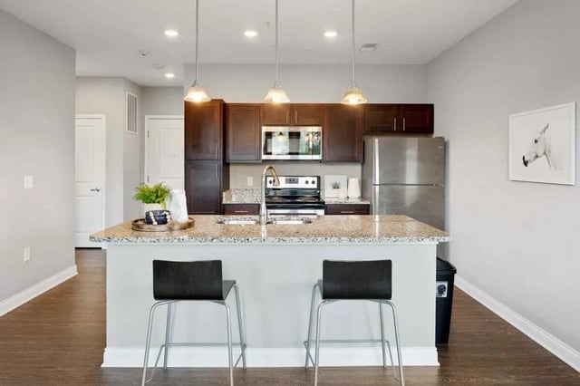 Counter with two bar stools and appliances kitchen at Midtown Stillwater in Stillwater Student Accommodation