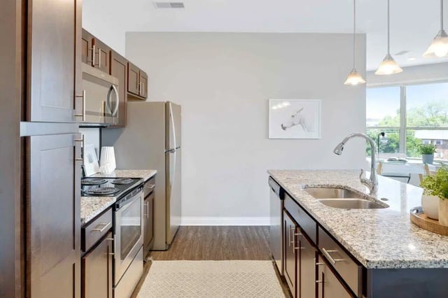 Kitchen with stainless steel appliances and granite countertops kitchen at Midtown Stillwater in Stillwater Student Accommodation