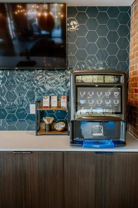 Coffee machine Tazo tea and television common area at Industry Cincinnati in Cincinnati Student Accommodation