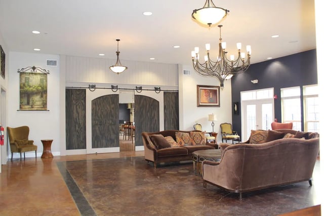 Sofa, chairs, sliding doors, chandelier living room at The Grove at Cheney in Cheney Student Accommodation