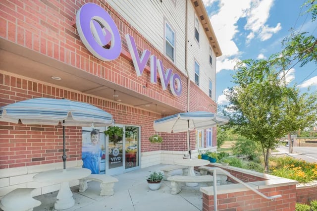 Vivo building entrance with outdoor seating exterior at Vivo | Toledo in Toledo Student Accommodation