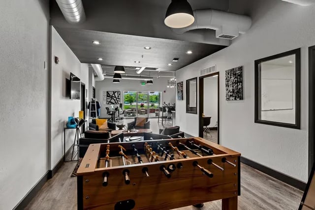 Foosball table in lounge area with seating Living room at Vivo | Toledo in Toledo Student Accommodation