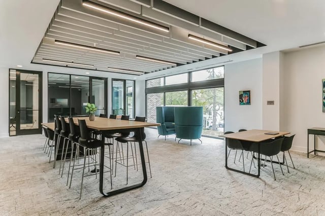 High-top table with chairs lounge area communal space at Current Midtown in Williamsburg Student Accommodation