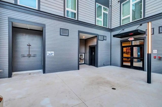 Outdoor shower area entrance and windows exterior at Junction 49 in Charlotte Student Accommodation