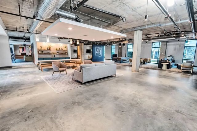 Modern lounge area with sofas pool table and tables. at Junction 49 in Charlotte Student Accommodation