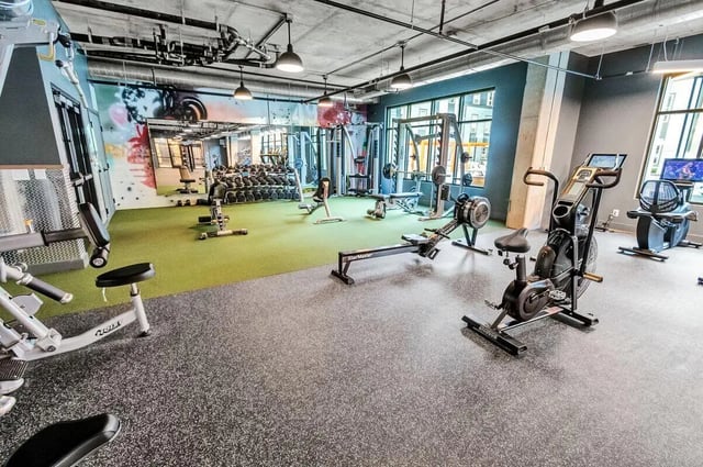 Weight racks exercise bikes rowers gym area at Junction 49 in Charlotte Student Accommodation