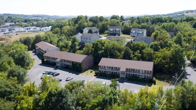 Apartment buildings with parking lots exterior at Grand Duke in Harrisonburg Student Accommodation