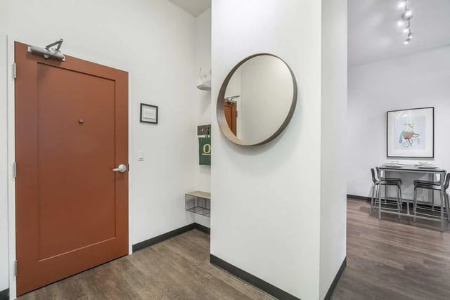 Hallway with mirror and dining table setup entryway at Arena District in Eugene Student Accommodation