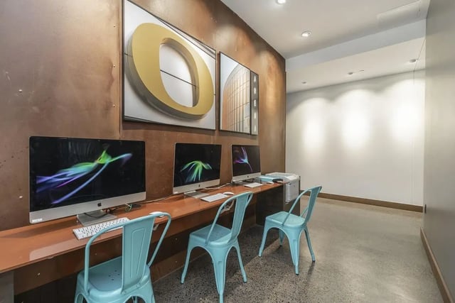 Computers chairs and artwork study area at Arena District in Eugene Student Accommodation