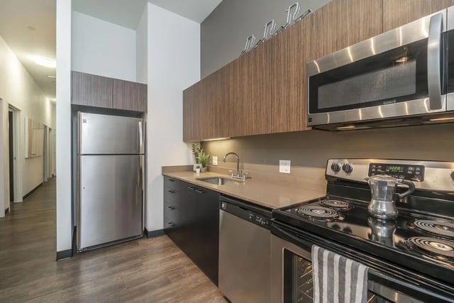 Stainless steel refrigerator oven sink dishwasher kitchen at Arena District in Eugene Student Accommodation