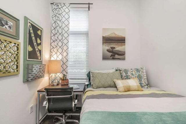 Bed desk chair and wall decor bedroom at Arena District in Eugene Student Accommodation