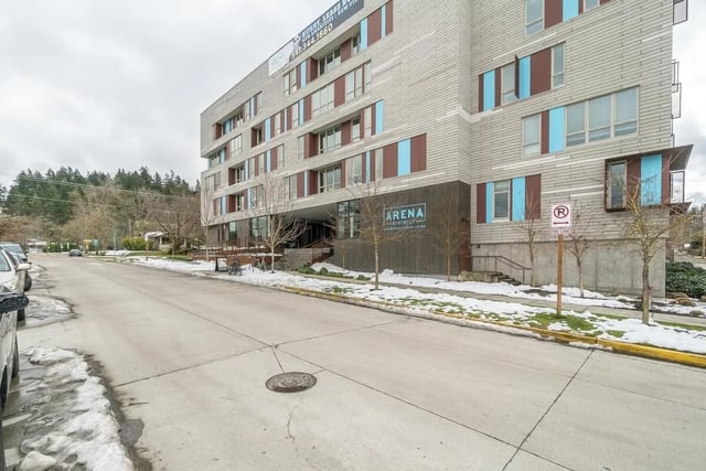 Modern building entrance with Arena District sign exterior at Arena District in Eugene Student Accommodation