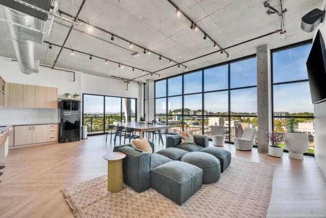 Modern living area with modular sofa and kitchen Living Room at Chapter at Eugene in Eugene Student Accommodation