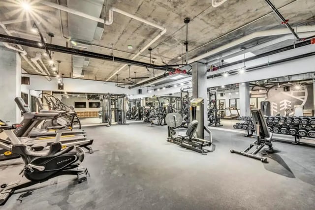 Treadmills weight machines and dumbbell rack fitness room at Chapter at Eugene in Eugene Student Accommodation