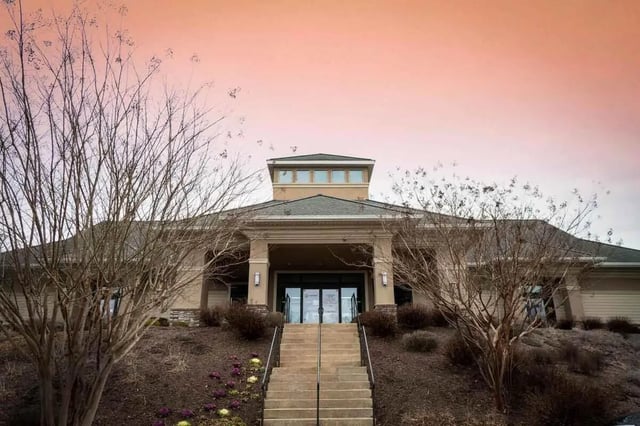 Building entrance with stairs and bare trees exterior at Copper Beech Townhomes - Harrisonburg in Harrisonburg Student Accommodation