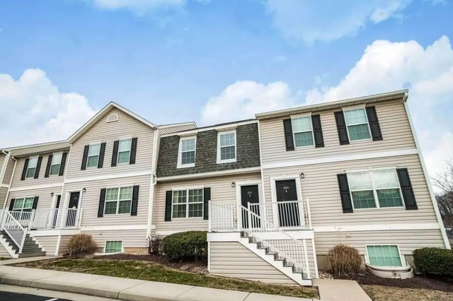 Townhouses with stairs and windows exterior at Copper Beech Townhomes - Harrisonburg in Harrisonburg Student Accommodation