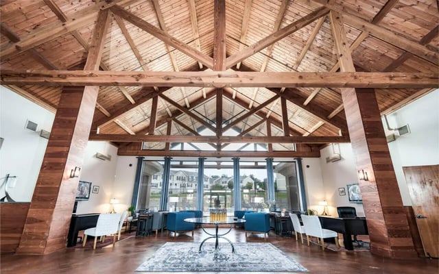Wooden beams and seating area living room at Copper Beech Townhomes - Harrisonburg in Harrisonburg Student Accommodation