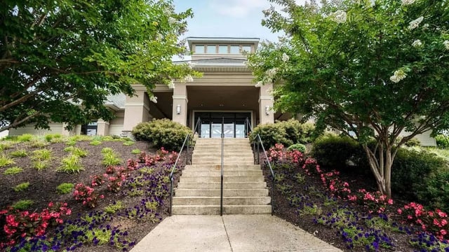 Entrance with stairs and landscaped flower beds Exterior at Copper Beech Townhomes - Harrisonburg in Harrisonburg Student Accommodation