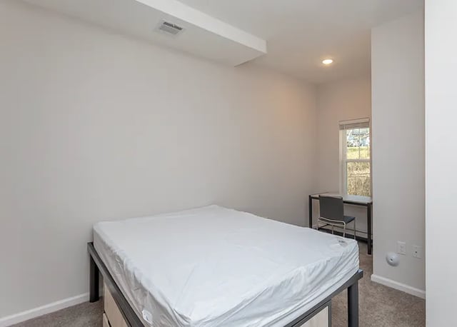 Bed desk chair with window bedroom at Rivers Walk in Boone Student Accommodation