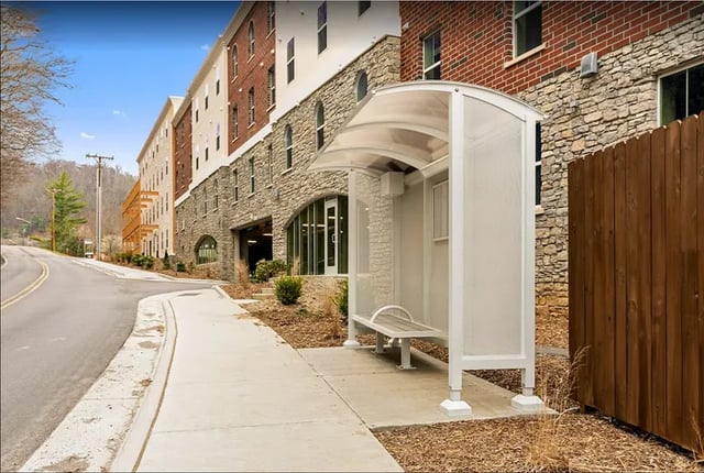Bus shelter with bench building exterior at Rivers Walk in Boone Student Accommodation