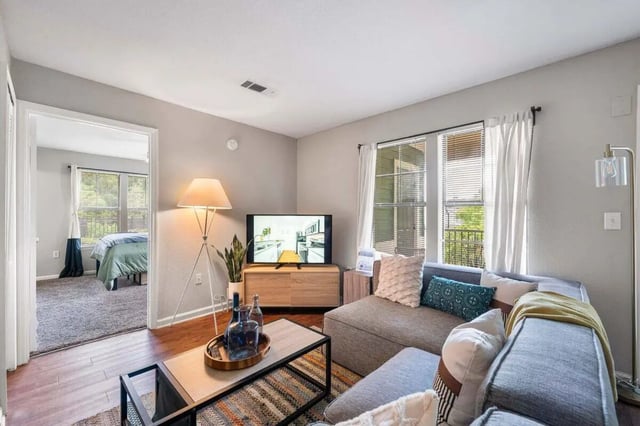 Sofa television and coffee table living room at The Wilde Raleigh in Raleigh Student Accommodation