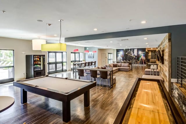 Pool table vending machine lounge living room at Rush Charlotte in Charlotte Student Accommodation