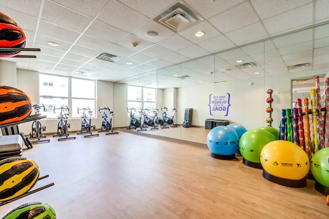Spin bikes exercise balls and weights gym area at Rush Charlotte in Charlotte Student Accommodation