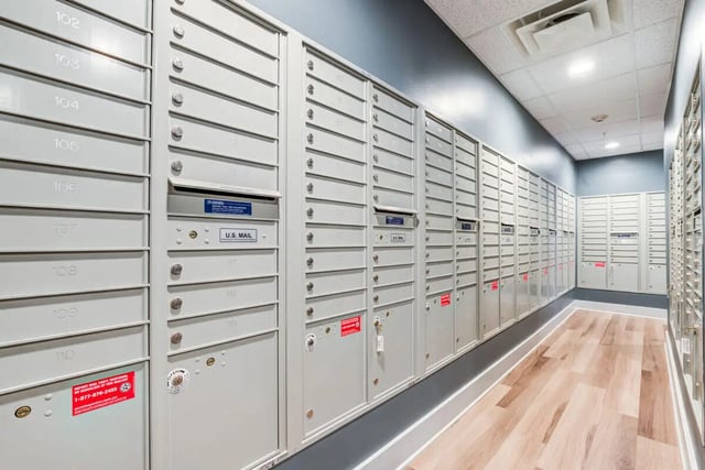 Mailboxes with numbered doors and slots Mailroom at Rush Charlotte in Charlotte Student Accommodation