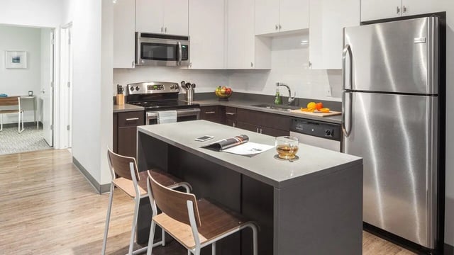 Modern kitchen with island stainless steel appliances kitchen at Latitude Lincoln in Lincoln Student Accommodation