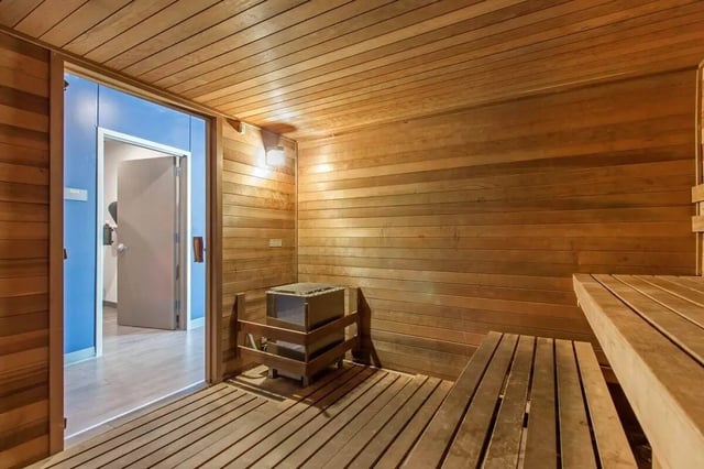 Wooden sauna with heater and benches sauna at Latitude Lincoln in Lincoln Student Accommodation