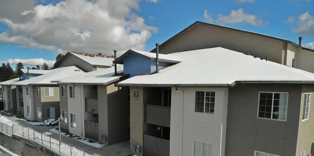 Snow covered apartment buildings with balconies exterior at Table Rock in Flagstaff Student Accommodation