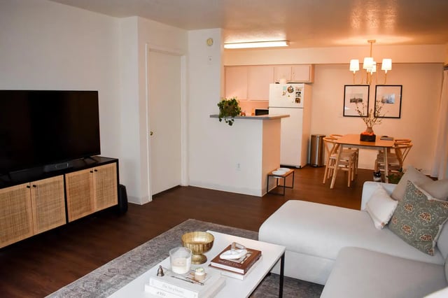 TV media console dining table refrigerator living room at Table Rock in Flagstaff Student Accommodation