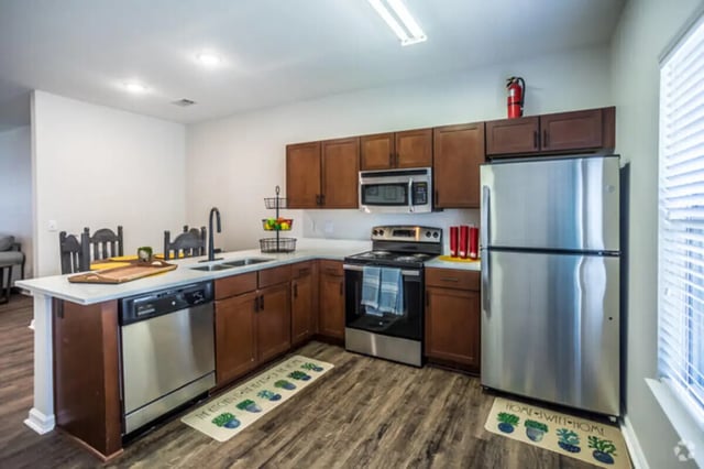 Modern kitchen with stainless steel appliances and cabinets kitchen at Traditions Oxford Apartments in Oxford Student Accommodation