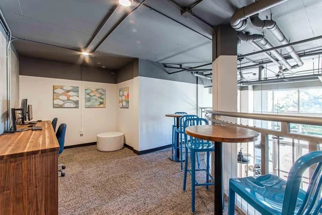 Desk chairs paintings round tables and stools study area at Patterson Social in Eugene Student Accommodation