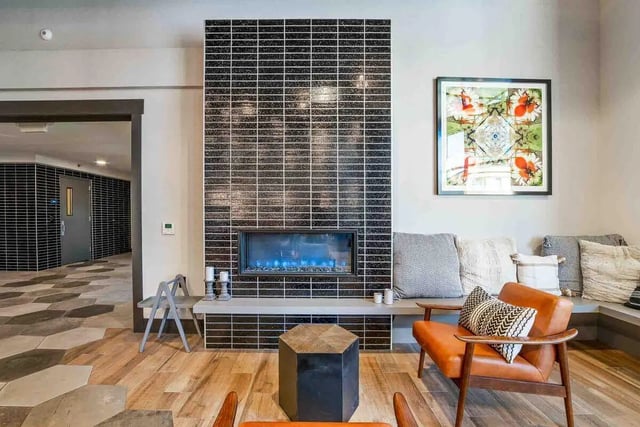 Modern living room with fireplace and seating area at Patterson Social in Eugene Student Accommodation