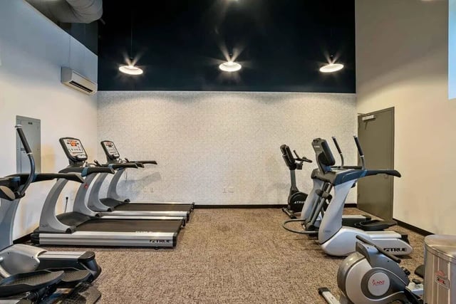 Treadmills and ellipticals in gym area at Patterson Social in Eugene Student Accommodation