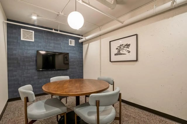 Round table four light blue chairs study area at Patterson Social in Eugene Student Accommodation
