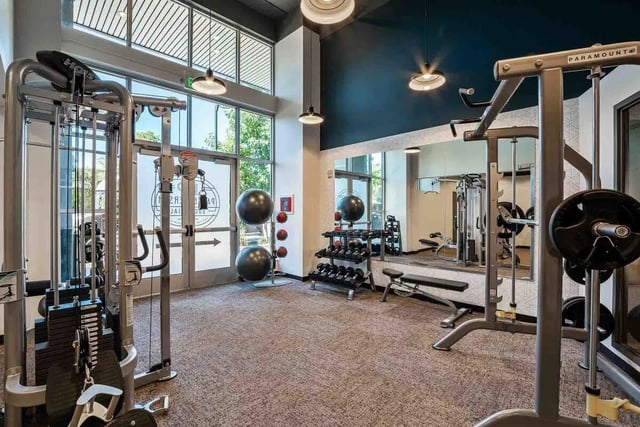 Weight machines dumbbells exercise balls gym room at Patterson Social in Eugene Student Accommodation