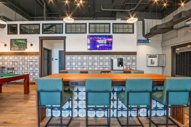 Billiard table bar with stools and television communal area at Patterson Social in Eugene Student Accommodation
