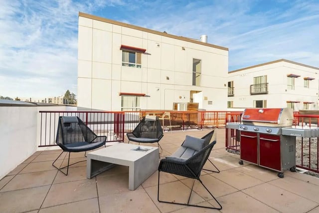 Chairs table grill patio exterior at Patterson Social in Eugene Student Accommodation