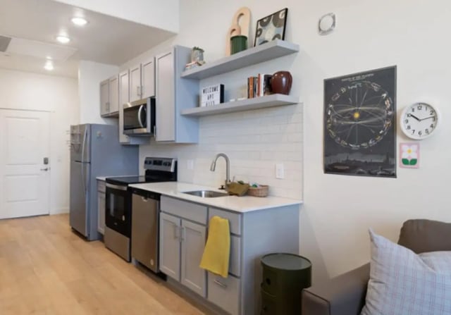 Kitchen with refrigerator stove sink and cabinets kitchen at Ivory University House in Salt Lake City Student Accommodation