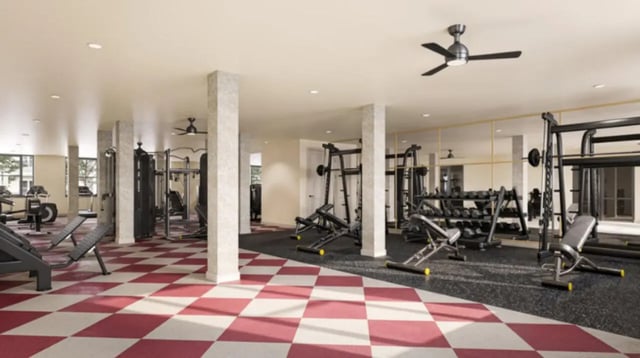 Weight racks treadmills and benches gym at Ivory University House in Salt Lake City Student Accommodation