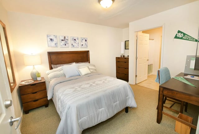 Bed nightstand dresser art desk chair bedroom at The Verge at Grand Forks in Grand Forks Student Accommodation