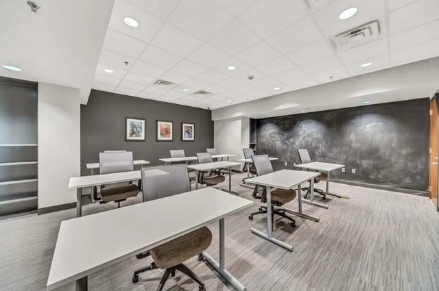 Desks chairs pictures on wall study area at 12 North in College Station Student Accommodation
