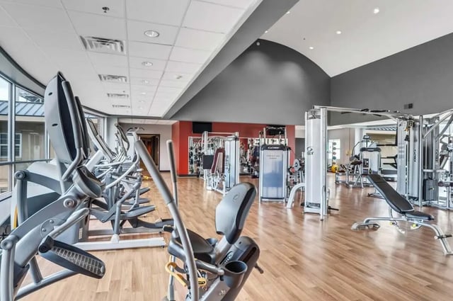 Ellipticals and weight machines in bright gym at 12 North in College Station Student Accommodation